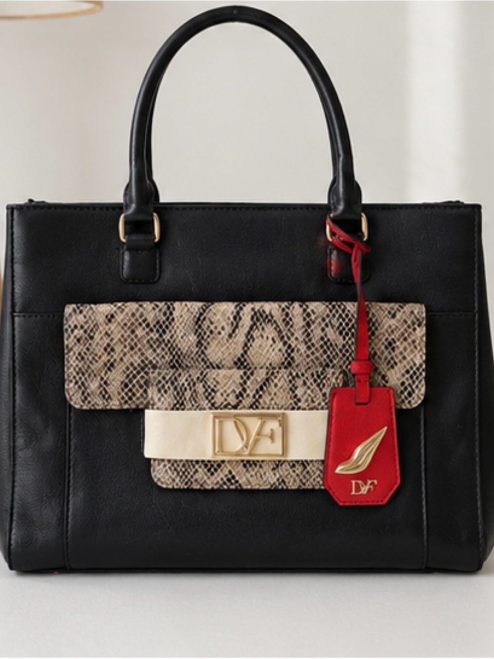 Diane Von Furstenberg Black Leather Satchel with Snake-Print Flap and Red Tag